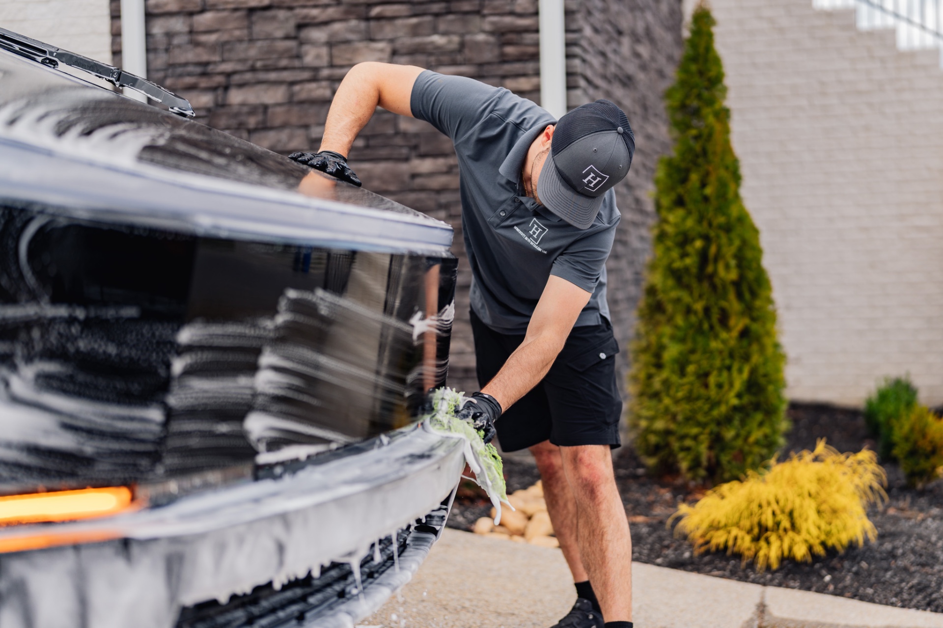 Honeycutt Auto Detailing mobile detailer washing luxury vehicle in Nashville Tennessee